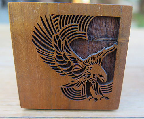 WOOD DESK BASE WITH LASER ENGRAVING OF AN EAGLE.